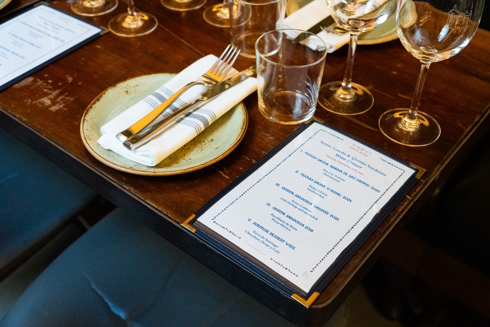 Table set with a wine dinner menu at a NYC restaurant client