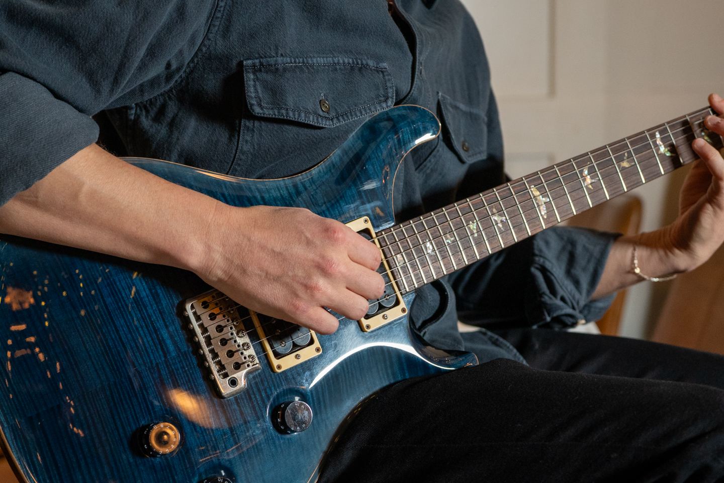 Guitarist performing live at a NYC restaurant event, shot for a Getalife Studios client