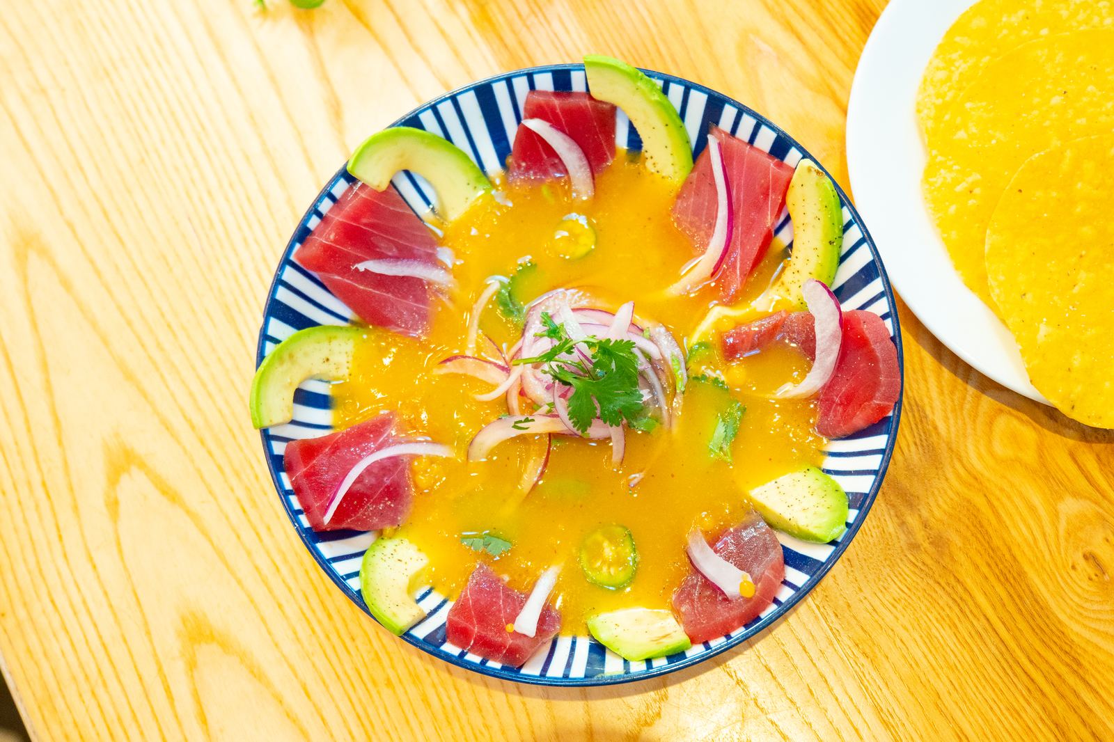 Tuna tiradito served on a tortilla chip at a NYC restaurant