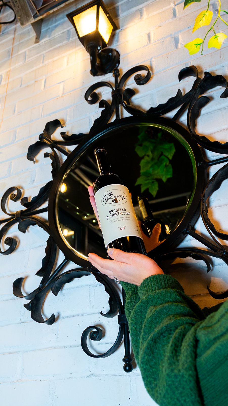 Bottle of Brunello di Montalcino held up at a NYC wine bar, shot for a Getalife Studios client