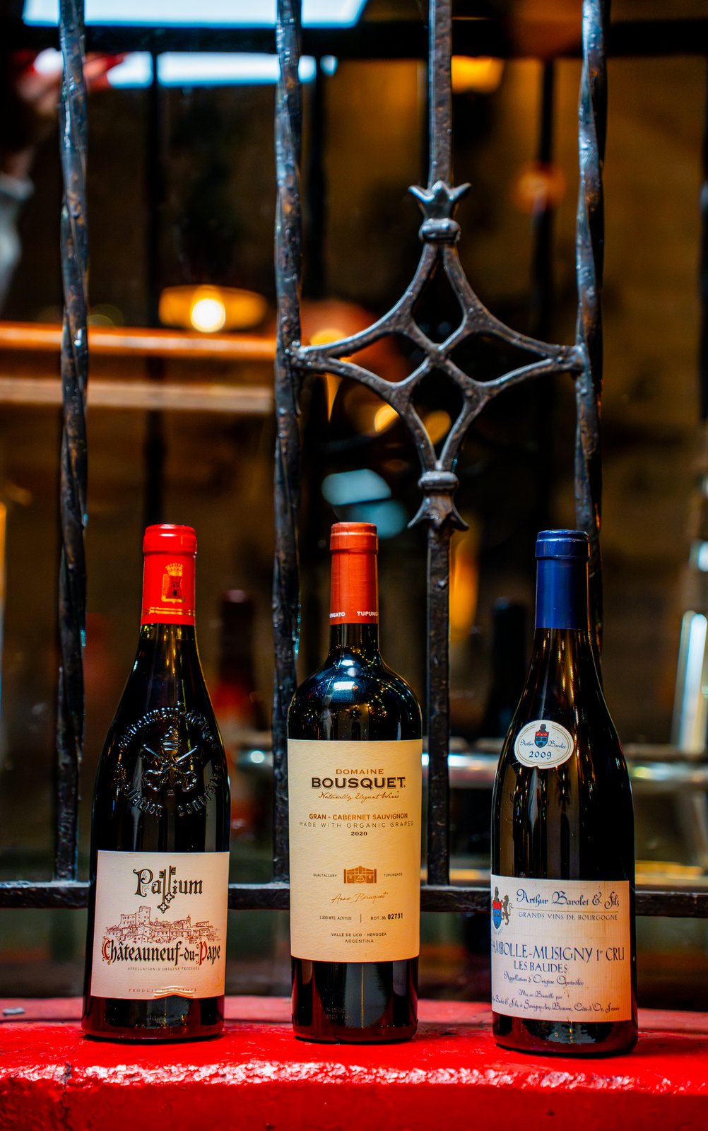 Three wine bottles displayed together at a NYC wine bar, shot for a Getalife Studios client
